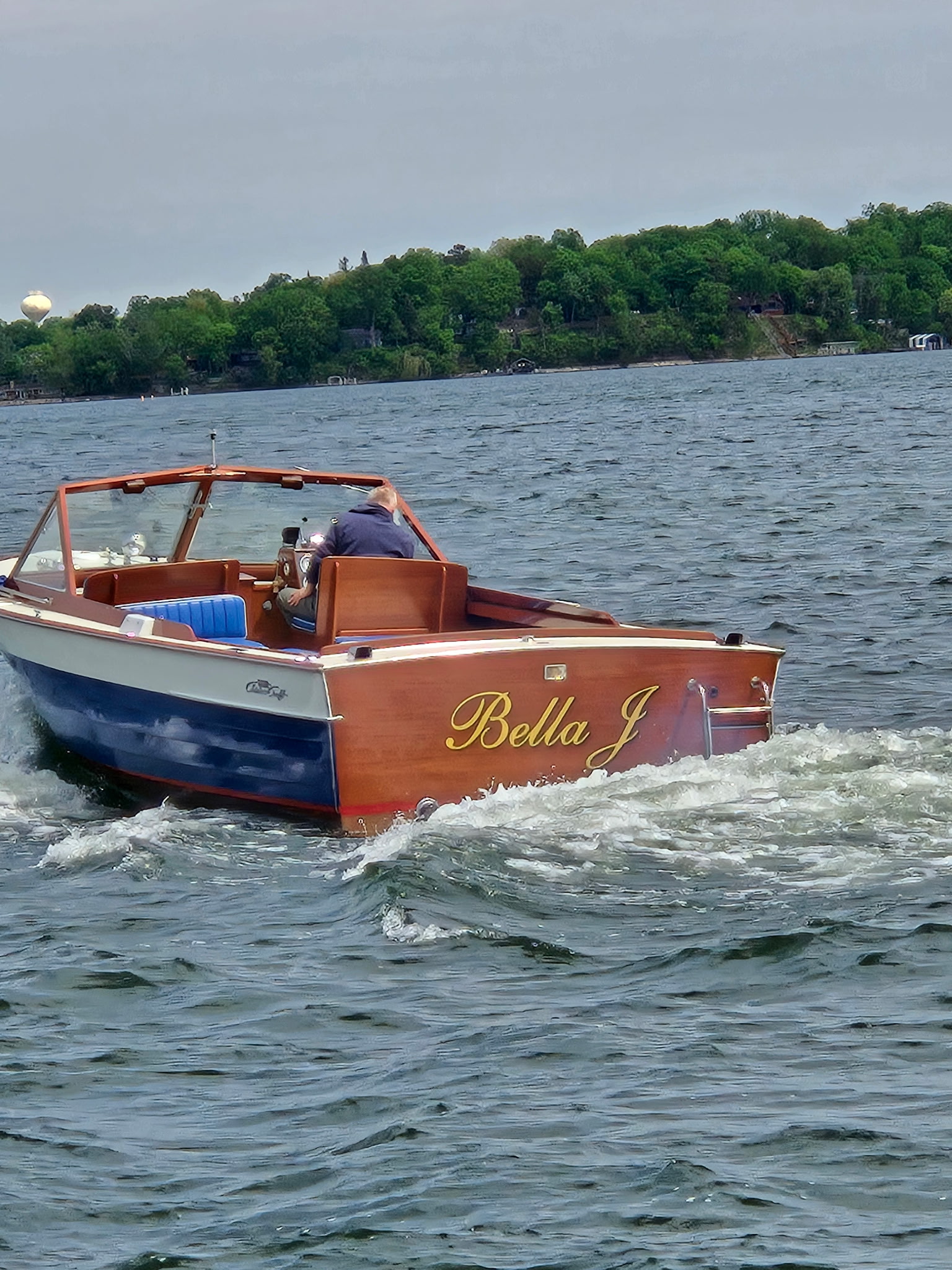 'Bella J' — close-up of the restored mahogany hull and transom.