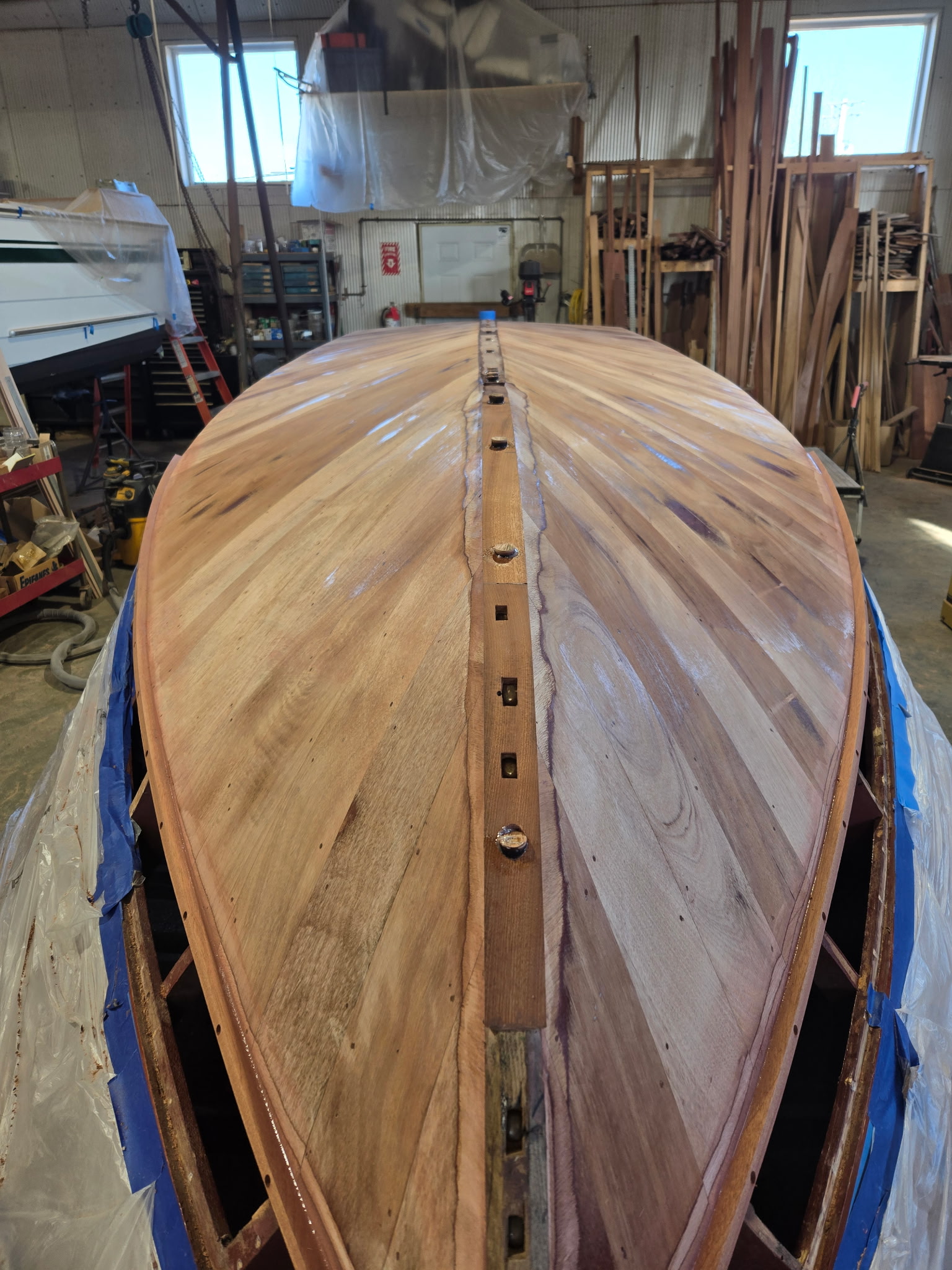 Beautiful natural wood grain on a classic wooden boat hull.
