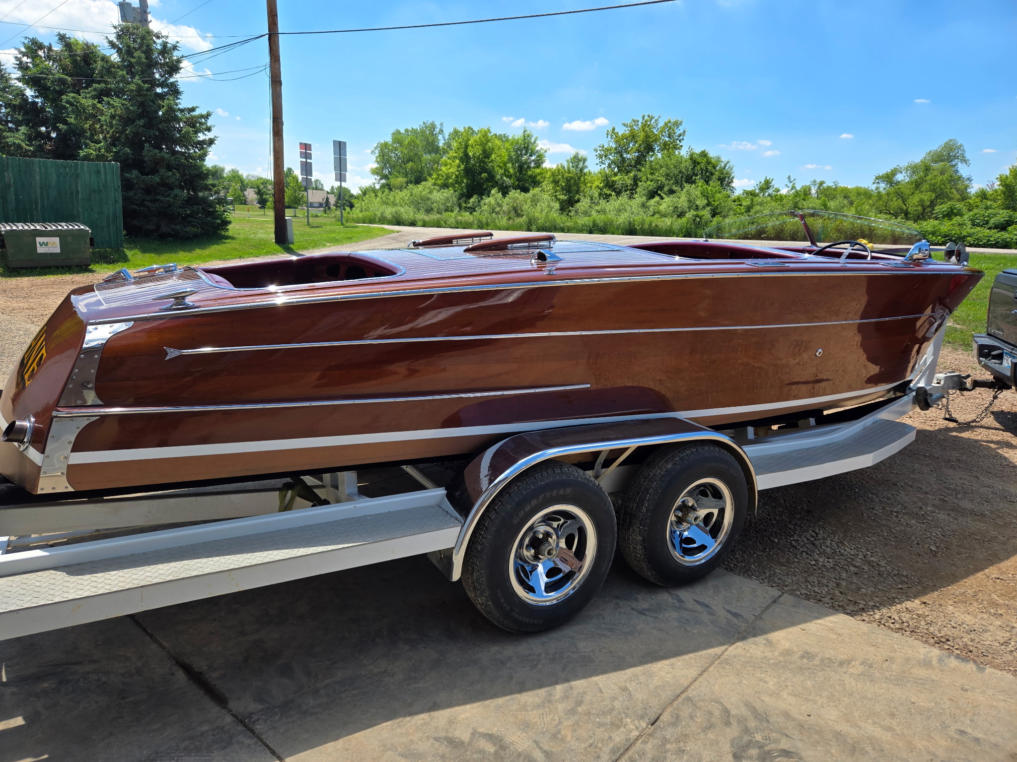 A fully restored mahogany runabout — mirror varnish finish, ready for the water.