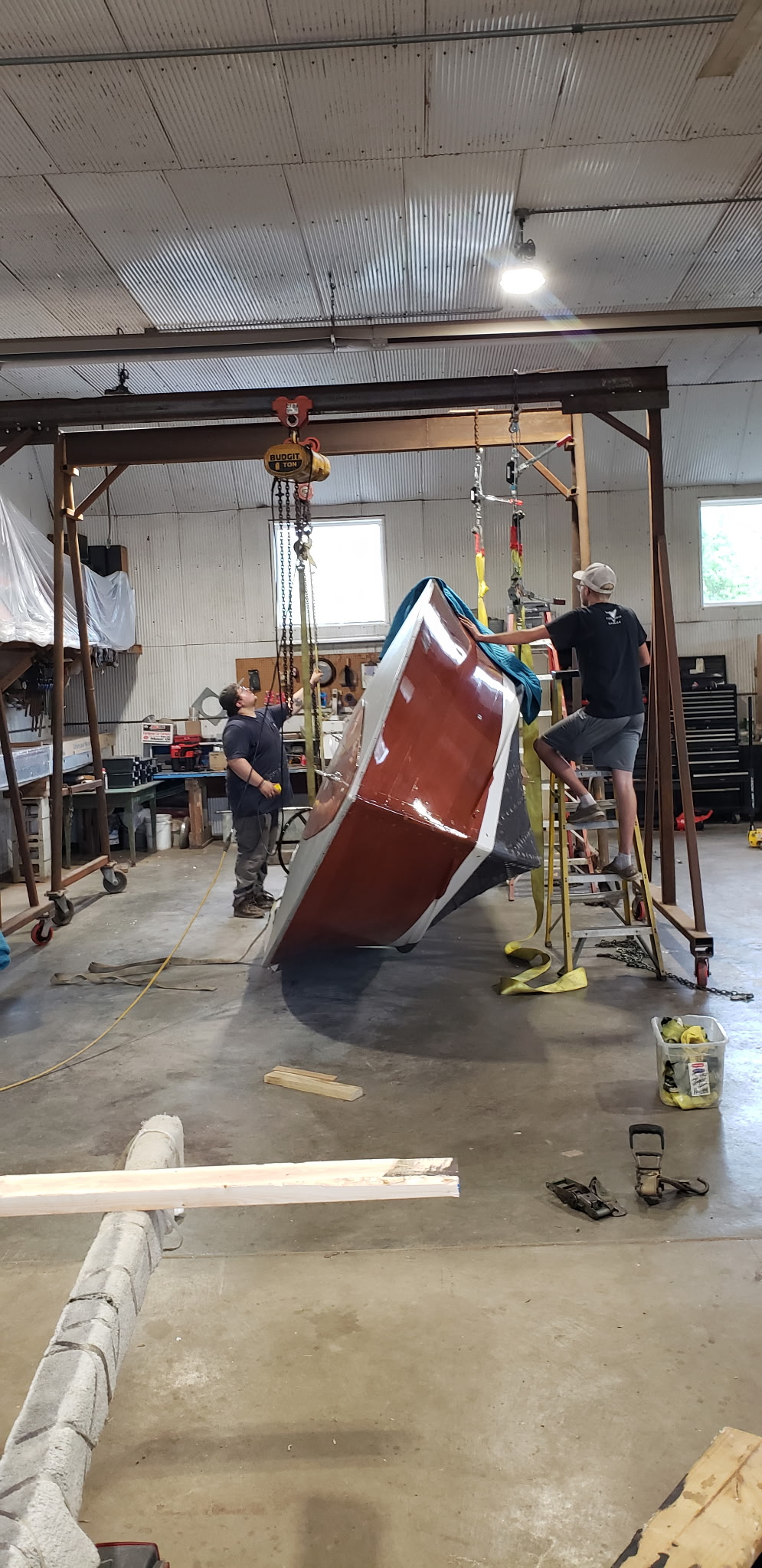 Classic wooden boat being worked on in the Midwest Boat Appeal shop.
